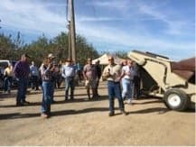 Side-By-Side Demonstrations Of Low-Dust Harvesting Equipment Draw Much Interest